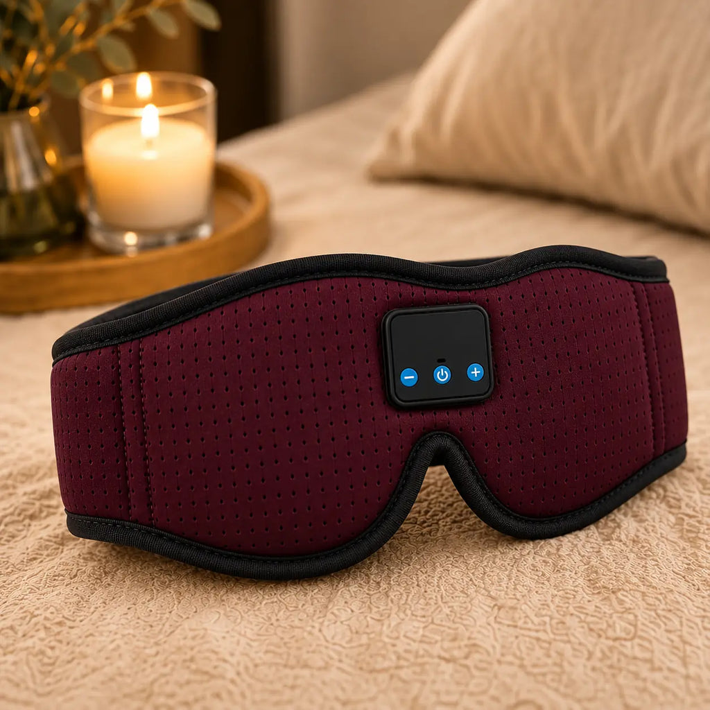 Gros plan sur les boutons de commande Bluetooth intégrés au masque de sommeil Noleva Burgundy
